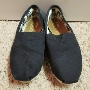 Toms black slip-on shoes